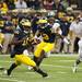 Michigan senior quarterback Denard Robinson quickly changes direction against Michigan State on Saturday. Michigan won 12-10. Daniel Brenner I AnnArbor.com